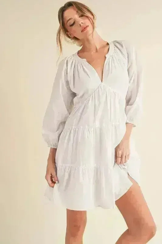 Aemi + Co Notched Balloon Sleeve Tiered Mini Dress