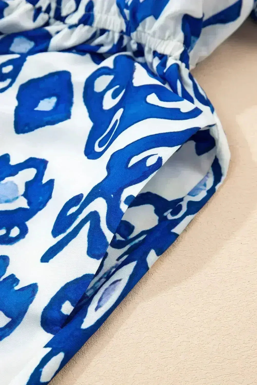 Blue Floral Ruffle Hem Pop of Color Neckline Dress