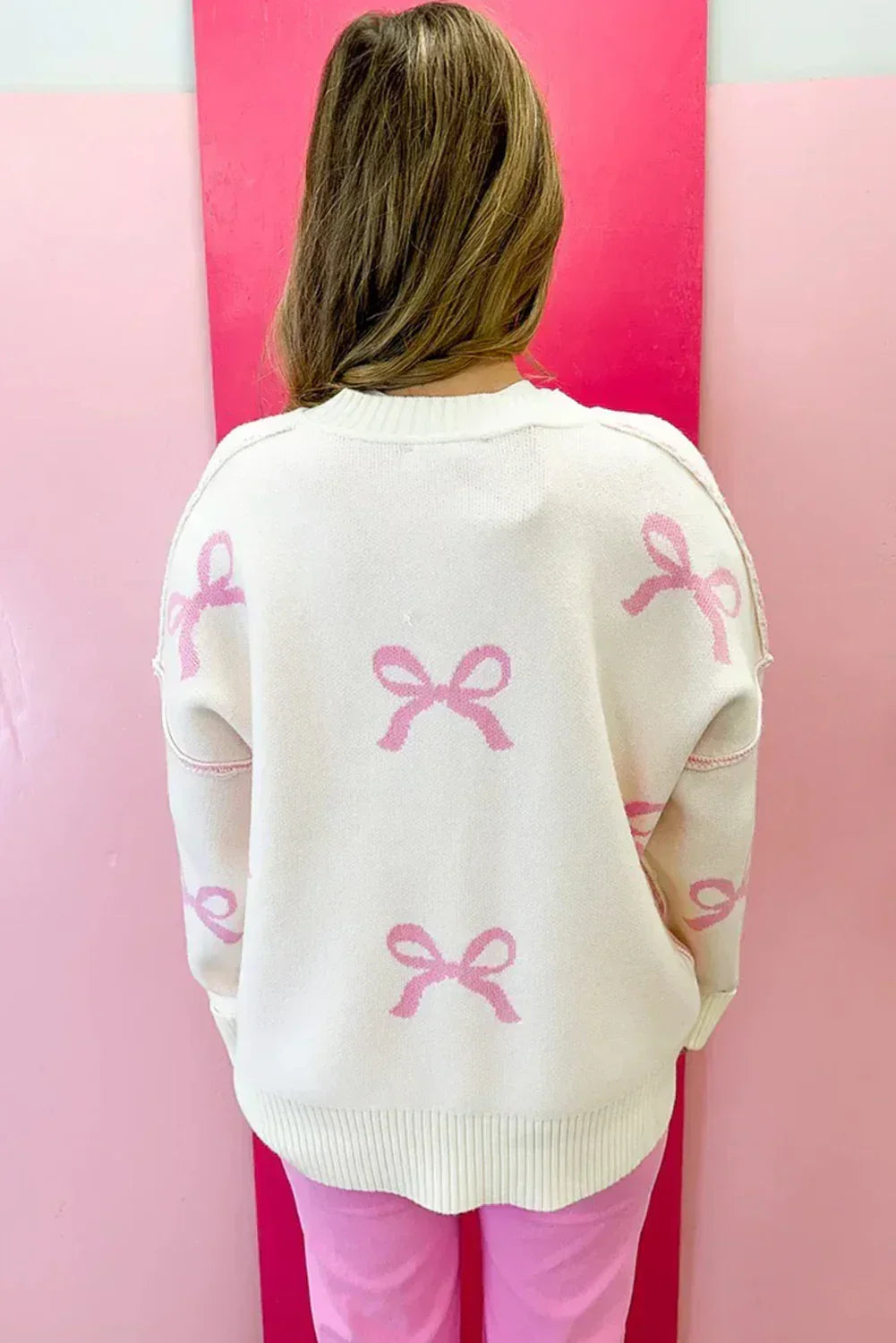 Pink Bow Print Exposed Seam Drop Sleeve Sweater